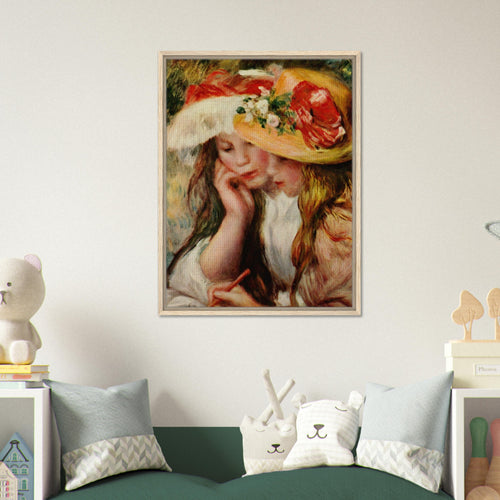 Deux jeunes filles lisant de Pierre-Auguste Renoir, œuvre impressionniste reproduite sur toile avec cadre en bois clair, pour décoration murale.